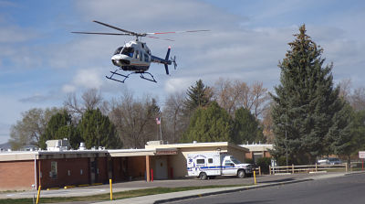 A helicopter is flying over the hospital