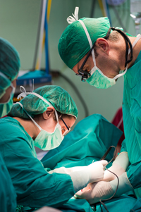 This picture is showing a team of surgeons operating